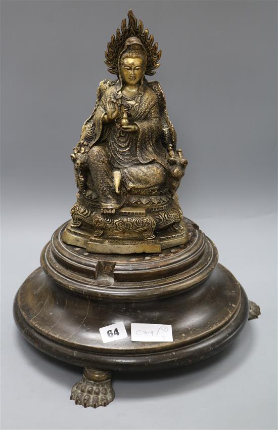 A Buddha and an associated wooden base on claw feet height excl. stand 28.5cm
